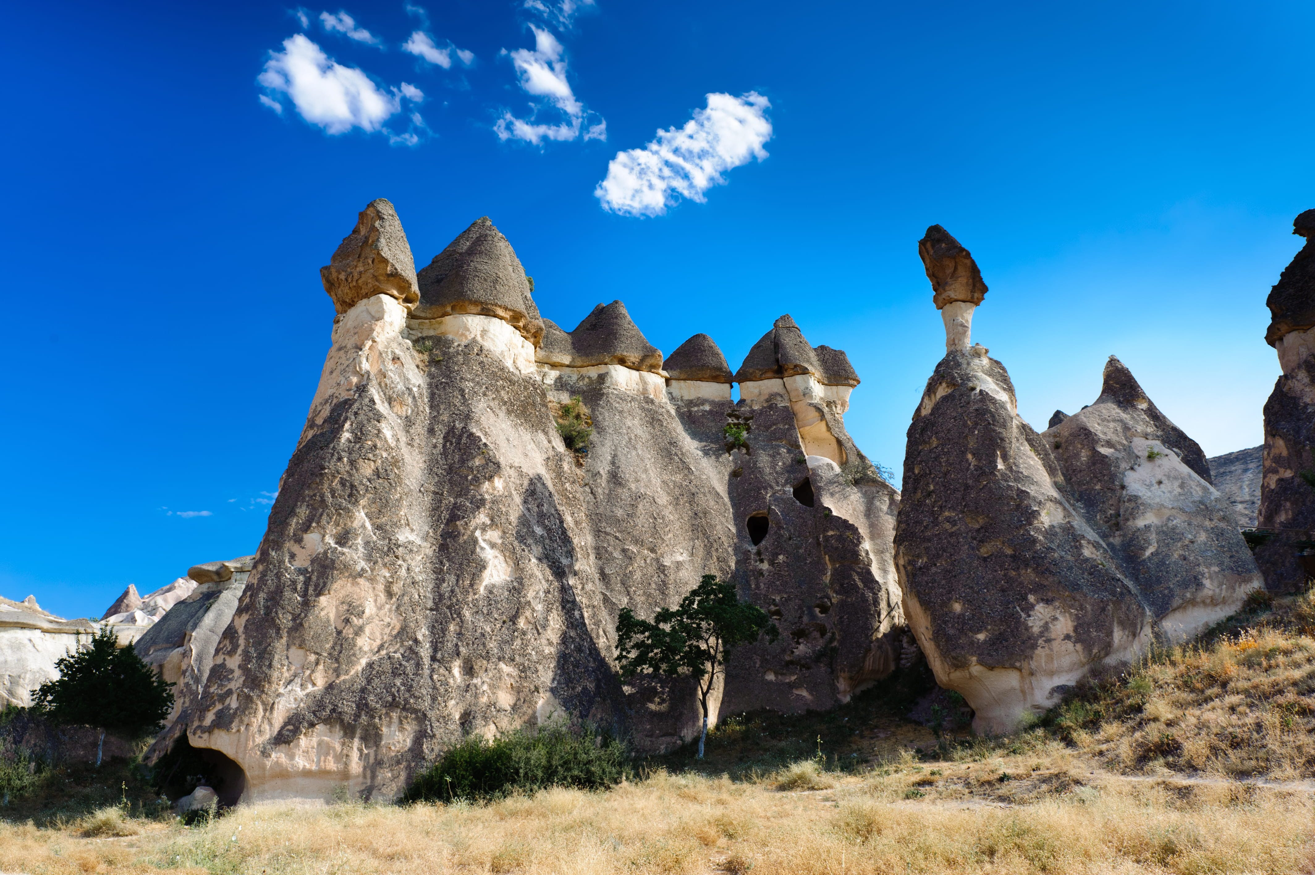 Hot air balloons flying over Cappadocia fairy chimneys